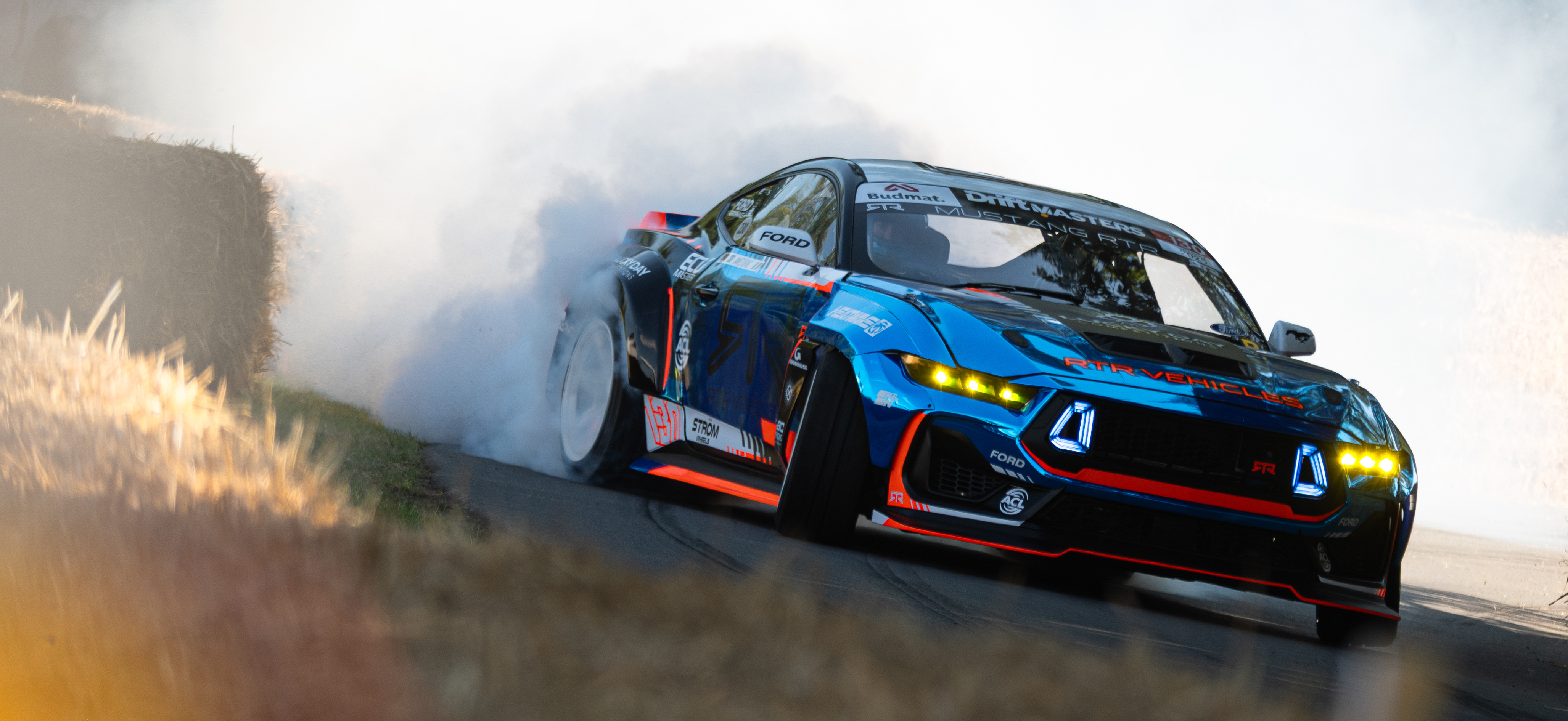 A photo of the Mustang RTR drifting around Molecomb at the 2025 Goodwood FOS