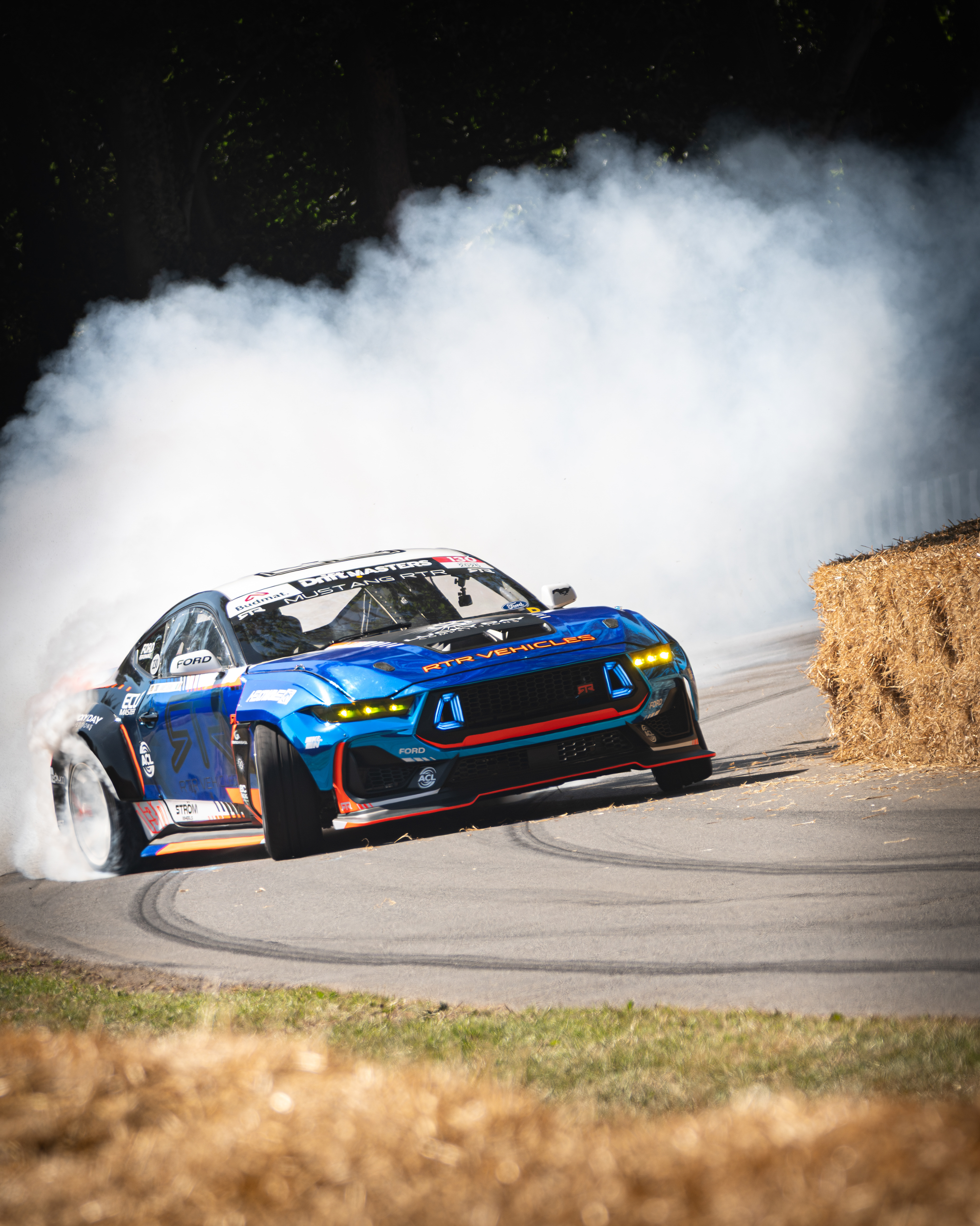 A photo of the Mustang RTR drifting around Molecomb at the 2025 Goodwood FOS